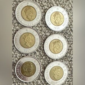These are Canadian $2 coins, commonly called “Toonies.